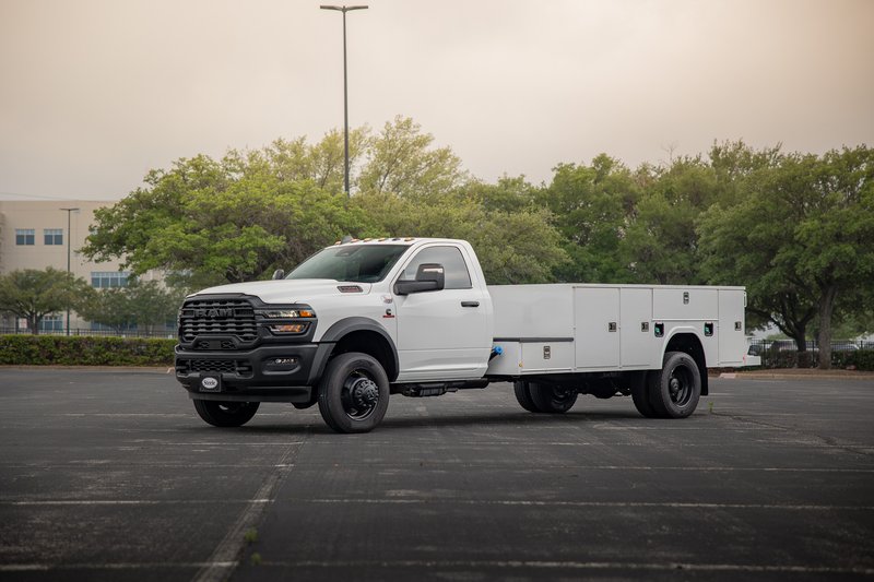 White Ram 5500 RKI with a utility body and black rims.