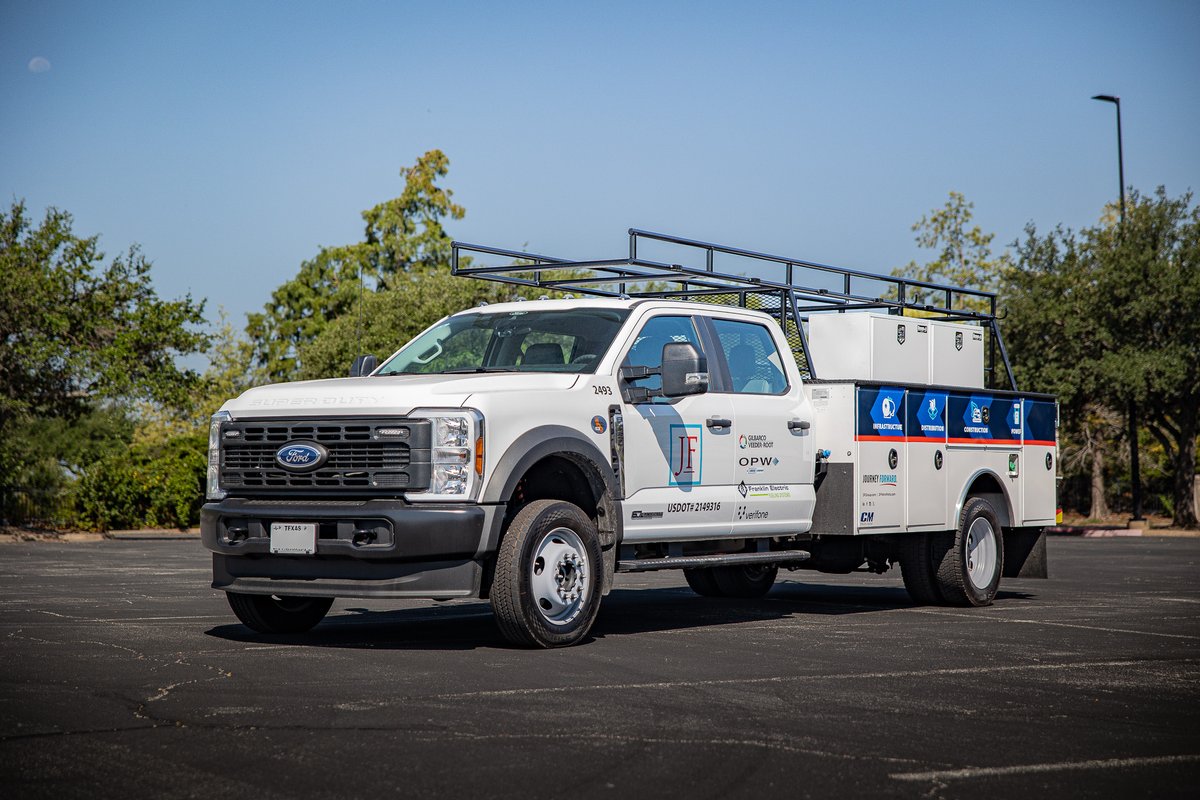 White 2026 Ford F-450 with utility body and rack, displaying company livery.