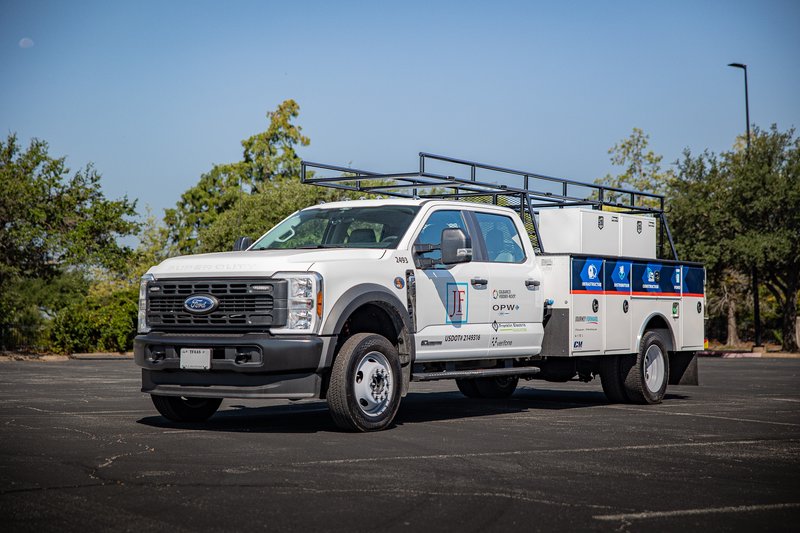 White 2026 Ford F-450 with utility body and rack, displaying company livery.