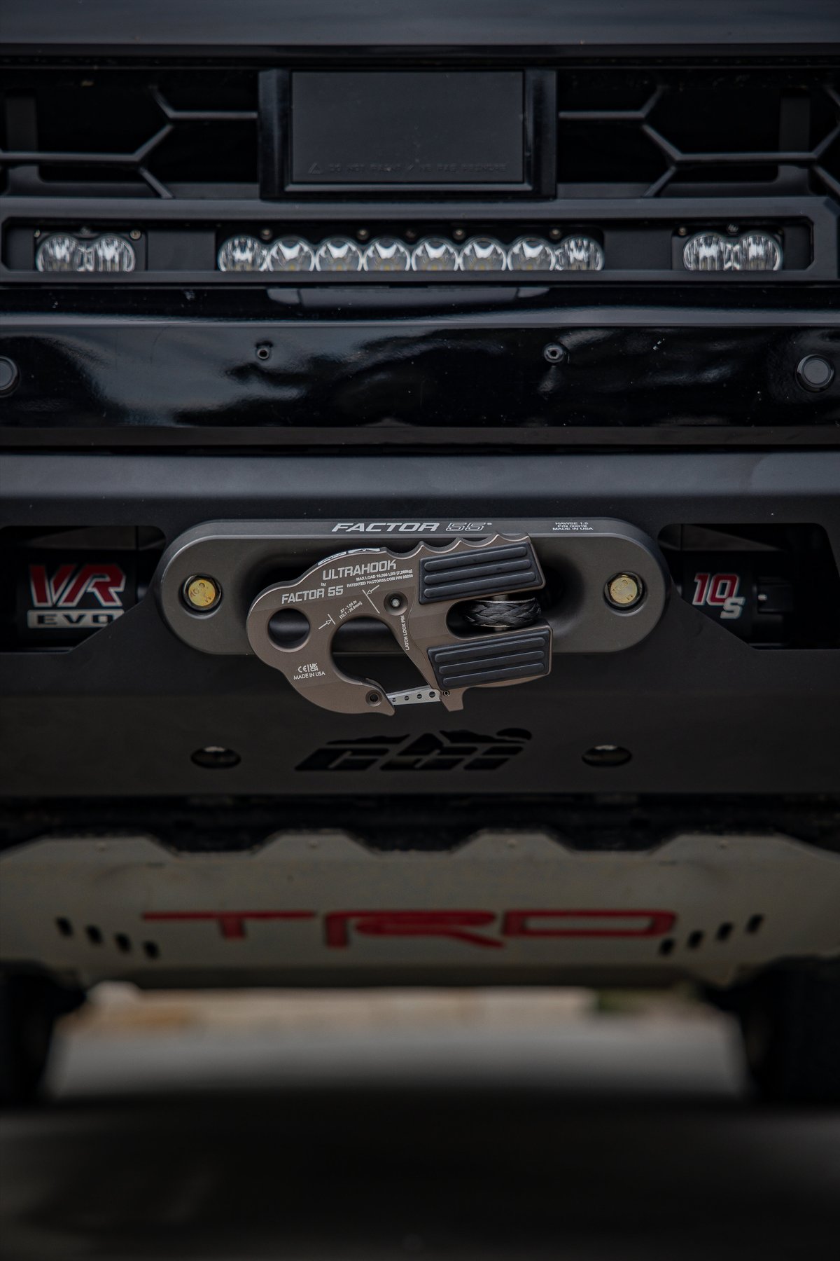 Black Toyota TRD off-road bumper with Factor 55 Ultrahook winch shackle.